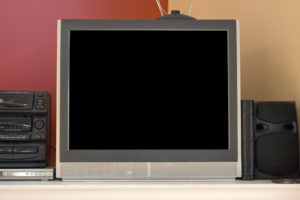 A modern picture tube tv set - 32 inch. Standard aspect ratio, non-widescreen. Also in the shot is a set top antenna, stereo, and dvd player. Included clipping path for the screen.