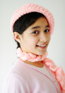 Cute teen girl with pink hat